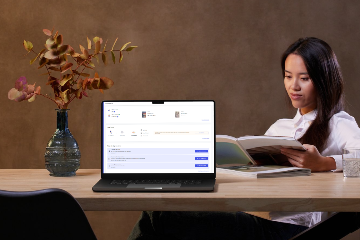 Woman reading with a laptop displaying the publishdrive platform